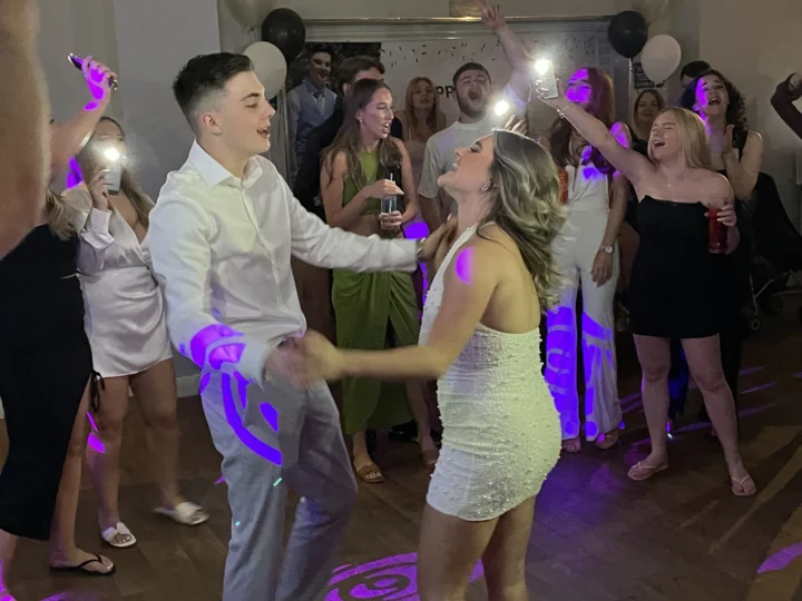 Birthday party first dance with purple lighting and phone flashlights - Essex DJ